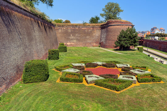 Historic brick bastion walls and ornamental garden at Alba Carolina Citadel in Alba Iulia Romania