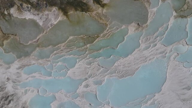 Aerial view of breathtaking natural site of white travertine thermal terraces, Pamukkale, T&uuml;rkiye	

