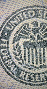 Animated Closeups of Dollars Bill Engraving Details. US dollar bill details move through stop motion macro animation. Close views reveal engraved patterns seal artwork and currency lettering.