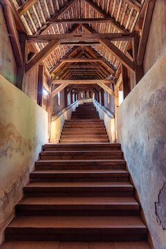Wooden covered staircase inside Biertan fortified church complex in Transylvania Romania