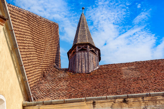 Wooden roof turret and traditional tile roofs at Biertan fortified church in Romania