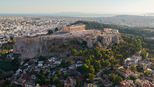 Aerial view of the Acropolis and the Parthenon temple situated on a rocky outcrop above the historic city of Athens, Greece.