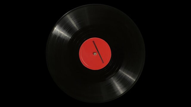 Vinyl record with blank label spins on turntable platter