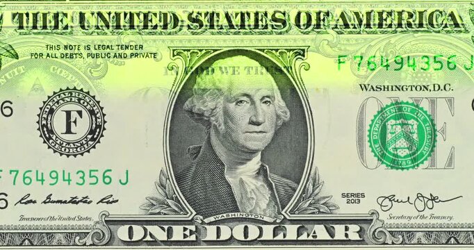 United States One Dollar Note with Scanning Effect. United States one dollar note passes through scanning effect as bright green bands cross paper bill revealing its printed portrait and seals.