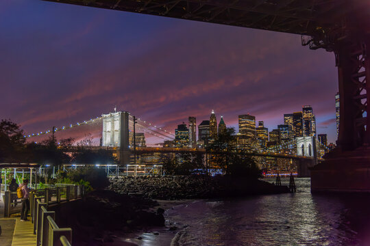 Brooklyn Bridge and Manhattan skyline at night viewed from Brooklyn