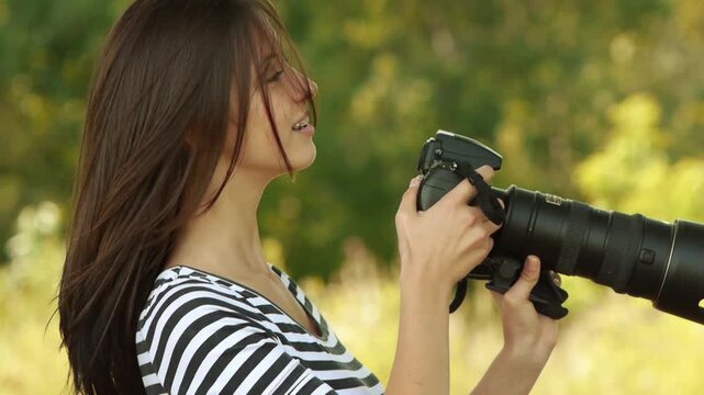 beautiful woman photographed with camera