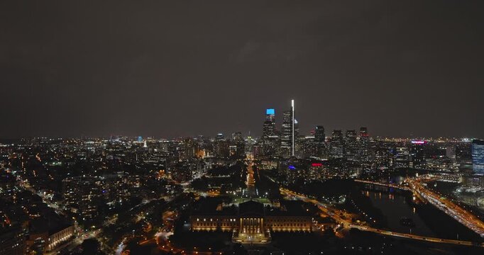 Philadelphia Pennsylvania Aerial v137 reverse flyover the museum capturing illuminated Benjamin Franklin parkway leading to downtown cityscape at night - Shot with 8k Camera - Sept 28th 2023