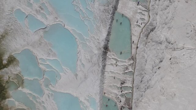 Aerial view of breathtaking natural site of white travertine thermal terraces, Pamukkale, T&uuml;rkiye	

