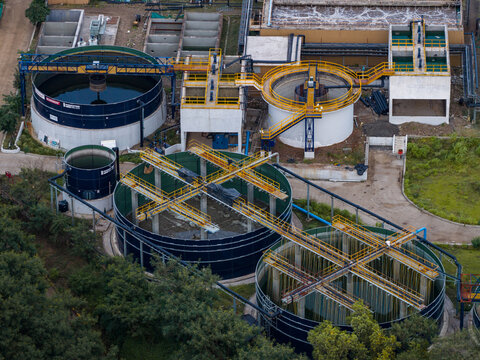 Aerial view of the Remondis ETP plant featuring large circular water treatment tanks and industrial infrastructure in Chakan, Maharashtra, India.