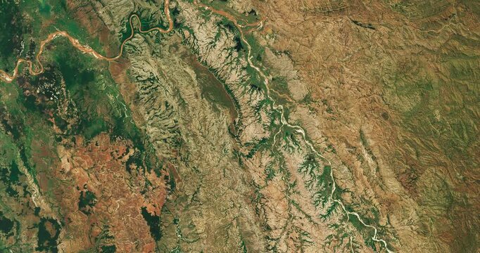 Top shot on meanders of river in moderate climate. Camera is moving forward and left. Animation based on image by NASA