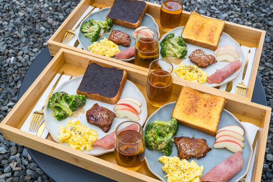 Arrangement of delicious breakfast trays featuring eggs and toast