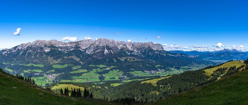 Stunning panorama view of Wilder Kaiser massif with Ellmauer Halt peak and Austrian Tyrolean Alps from mountain Brandstadl in summer on sunny day, Scheffau, Tyrol, Austria
