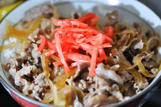 stir fried beef with vegetable and rice or Rice topped with stir fried pork or stir fried beef or Japanese food or Korean food or Beef Rice Bowl , Gyudon