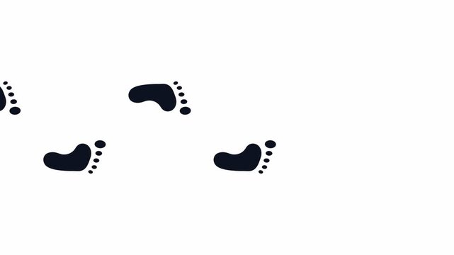 Human footprints walking forward across a plain surface. 4K Video