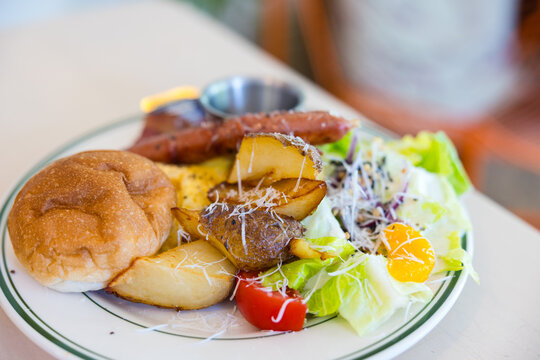 Top view of hearty breakfast platter served on ceramic plate&nbsp;