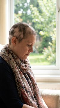 Autoimmune alopecia disorder: bald scalp, sick female, cancer therapy, chemotherapy consequence, sorrowful mood, medical patient, indoor recovery, oncology treatment.