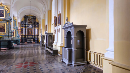 Quiet Confessionals in a Sunlit Cathedral