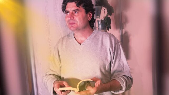 A man is reading a sacred book, and what he reads inspires him, giving him strength and hope.
