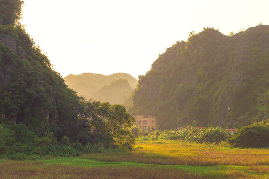 Picturesque karst landscape near Tam Coc village at sunset. Ninh Binh, Vietnam.