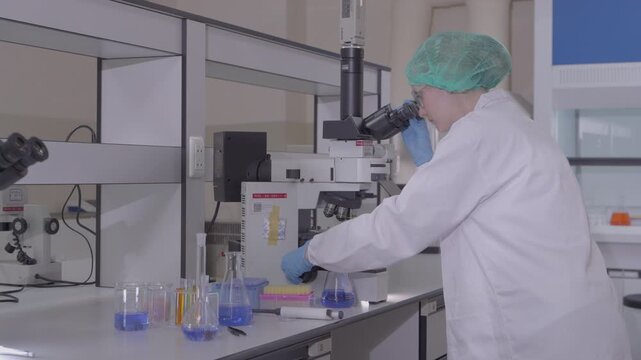 Science, microscope and study with of a woman in a laboratory for research and innovation. Medical, pharmaceutical sample and a young scientist in a lab for development, discovery or breakthrough