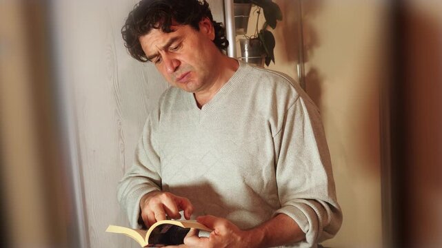 A man is reading a sacred book, and what he reads inspires him, giving him strength and hope.
