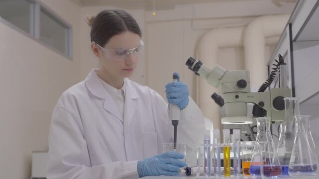 Science, microscope and study with of a woman in a laboratory for research and innovation. Medical, pharmaceutical sample and a young scientist in a lab for development, discovery or breakthrough