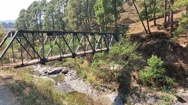 Steel Footbridge Over Mountain Stream in Pine Forest, Himalayan Hills, India