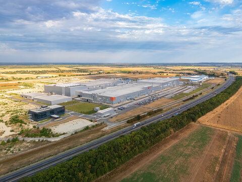 Ivancsa, Fejer County, Hungary - 25 August 2026: Aerial view of SK On EV battery factory within an industrial park near the M6 motorway, featuring large production and logistics facilities.