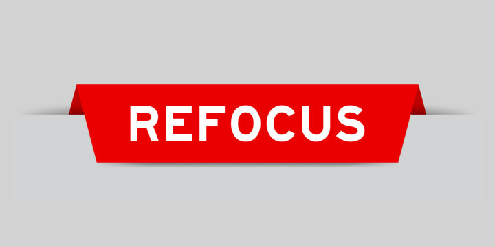 Red color inserted label with word refocus on gray background