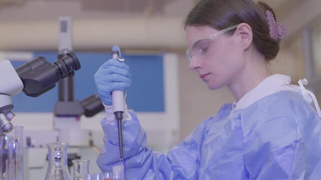 Science, microscope and study with of a woman in a laboratory for research and innovation. Medical, pharmaceutical sample and a young scientist in a lab for development, discovery or breakthrough