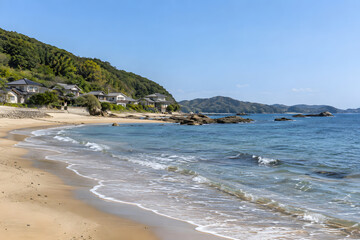 Fototapeta premium Quiet Beach Beside a Rural Japanese Coastal Village
