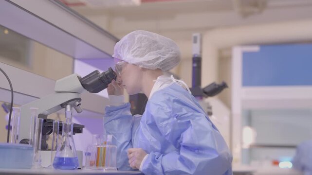 Science, microscope and study with of a woman in a laboratory for research and innovation. Medical, pharmaceutical sample and a young scientist in a lab for development, discovery or breakthrough