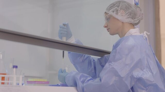 Woman medic works in bacteriological laboratory