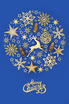 Merry Christmas sign with tree decorations of reindeer, stars, snowflakes, pine cones in circular shape on blue. Festive abstract ball design for Xmas season. 