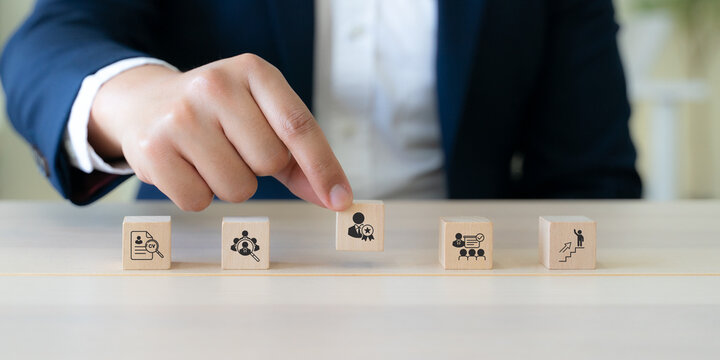 Talent Selection and Recruitment Process Strategy. Selecting top talent using wooden blocks with resume screening, candidate assessment, employee recognition, recruitment, and career advancement.