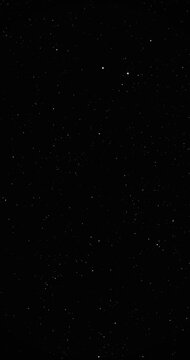 Dark Starfield with Glinting Points for Space Background Use. Twinkling pointed stars shift through smoothly rotating imitation space field. 