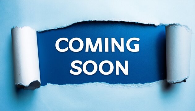white paper ripped to reveal blue background with coming soon in white