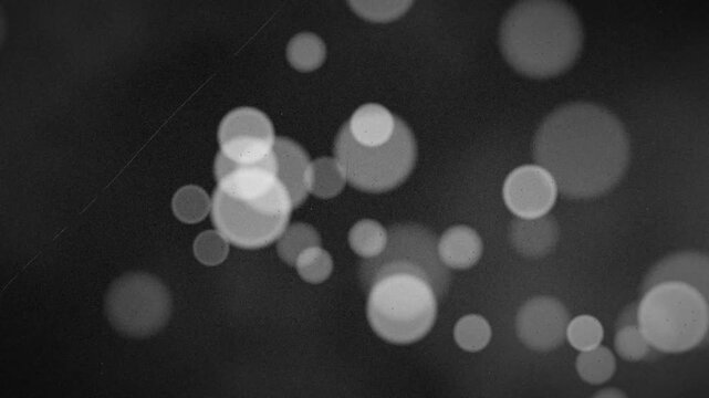 Vintage Film Grain and Monochrome Bokeh Circles Overlay Texture