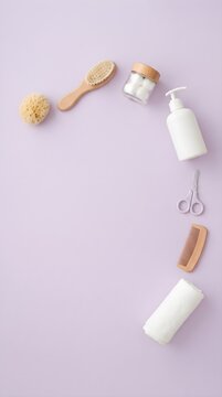 Purple Background with Curved Arrangement of Grooming Tools Flat Lay