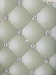 Obraz premium Upholstered leather wall panel texture background. Features diamond tufted design with decorative buttons. Luxury interior decoration material for modern home and office space.