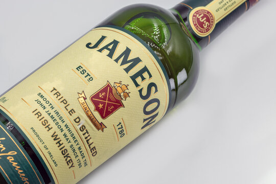 Jameson Triple Distilled Irish Whiskey bottle closeup on white.