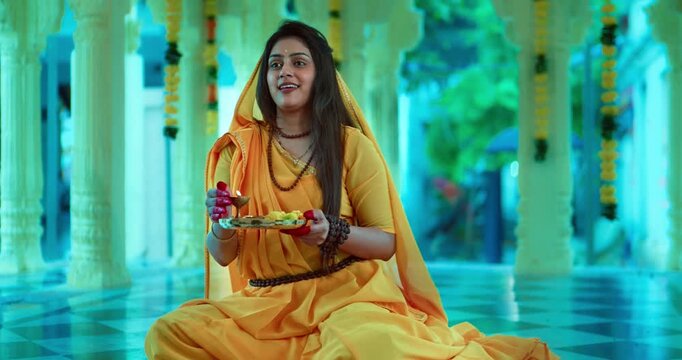 Indian Saint Mirabai Performing Aarti and Offering Prayers to Lord Krishna. Traditional Rajasthani devotional worship, Hindu temple rituals, and spiritual bhakti.