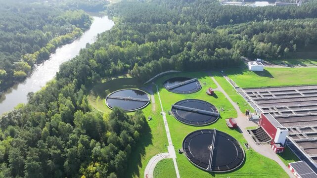 Aerial view of a modern water treatment plant facility with circular tanks