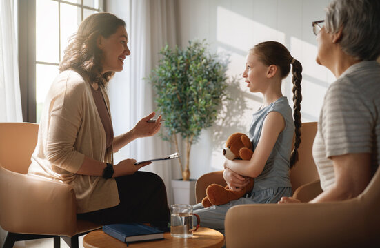 Child Psychologist Therapy Session with Young Girl