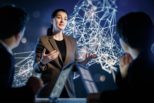 Confident Businesswoman Presenting Data Science Insights with Futuristic Network Visualization