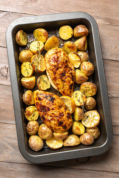Oven roasted lemon garlic chicken and baby potatoes with herbs