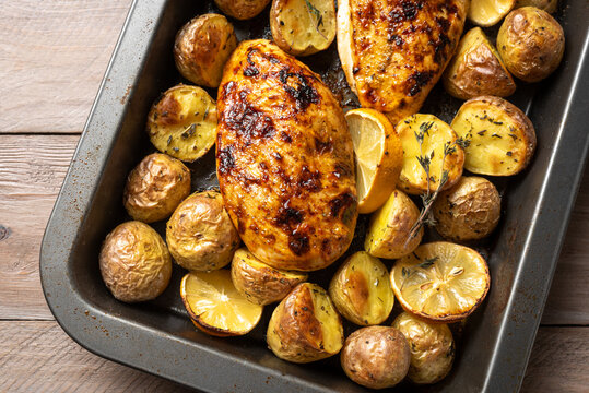 Oven roasted lemon garlic chicken and baby potatoes with herbs