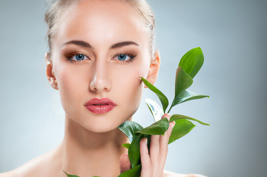 Natural Beauty Skincare Portrait with Fresh Green Leaves for Wellness