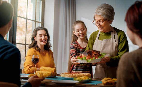 Happy Family Gathering Sharing Festive Dinner and Celebrating Together at Home
