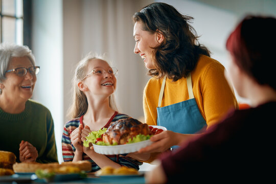 Happy Family Gathering Sharing Festive Dinner and Celebrating Together at Home